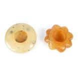 Two Chinese jade water, holders, circular 5.5 cm dia and another with symbols to each face, 5.3 cm