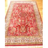 Large Keshan carpet, floral design over red ground and cream borders, 325x 200cm