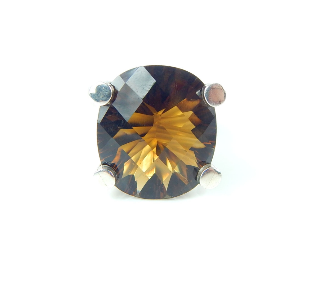 Smoky quartz dress ring, the deep claw setting on a silver band, 13g.