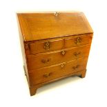 George III oak bureau with brass handles, fitted interior and key, two over two drawers, bracket