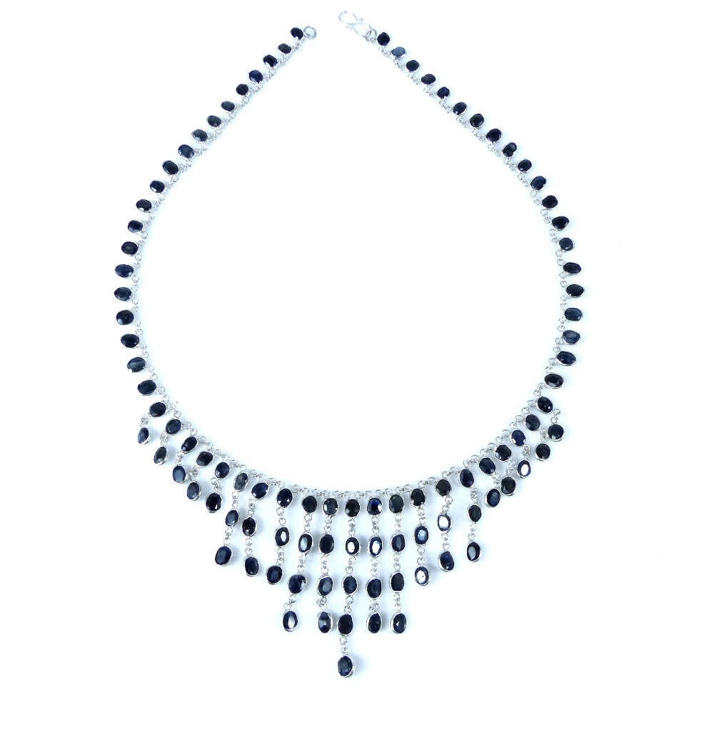 Sapphire fringe necklace, the oval cut stones mounted to a silver chain, 15g