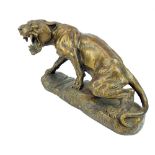 After Thomas-Francois Cartier (1879-1943), a standing bronzed statue of a snarling lioness,