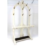 Victorian Gothic Revival hall stand, nine brass coat hooks, painted oak body,