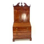 Georgian bureau bookcase, mahogany, swan neck pediment with urn finials, dentil band,