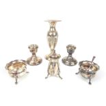 A group of silver to include a pair candlesticks, three piece cruet set and a vase