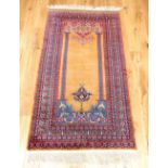 A Bokhara prayer rug with lamp and mihirab on camel field, 172x97cm.