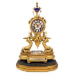 A late 19th century French gilt shaped mantle clock