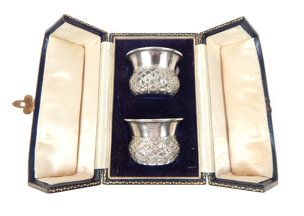 A cased pair of silver toddy cups