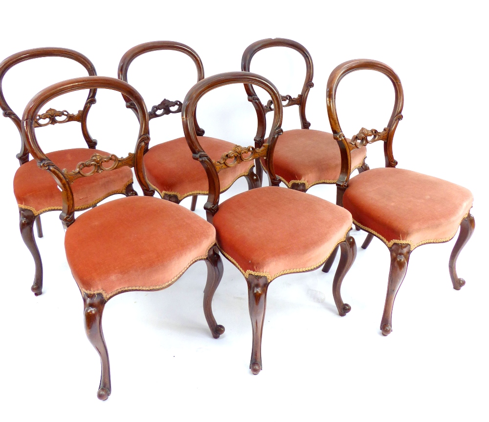 Set of six Victorian walnut balloonback chairs, scroll back rest, cabriole legs. (6)