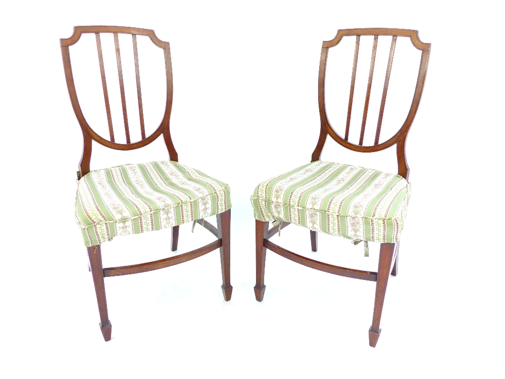 Pair of Regency style shield back salon chairs, c 1900, mahogany with embossed inlay, tapering box