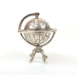 A minature 925 sterling standard desk ornament in the form of a globe