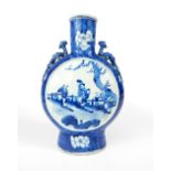 Chinese moon flask, blue and white glaze, dragons to shoulders, floral decoration, two panels of