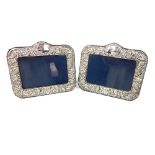 A pair of silver rectangular photograph frames