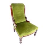 Victorian mahogany framed upholstered armchair, reeded decoration on turned legs.