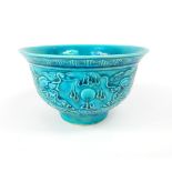 Chinese rice bowl, turquoise glaze, relief decoration of dragons and flaming pearl over the seas,