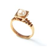 A vintage 9ct gold and pearl dress ring with pierced , overall weight 5.1g