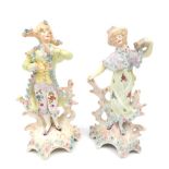 Pair of early 20thC Dresden figures in 18thC costume, traditional floral adornment, 15.2cm