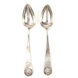 A pair of mid 19th century white metal serving spoons