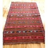 Sumak Persian hand made rug, mid 20th C earth ground with red and orange in geometric strips