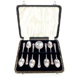 A cased hallmarked set of six solid silver tea spoons and caddy spoon