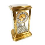 A late 19th century French brass and four glass mantel clock, white chapter ring with Roman