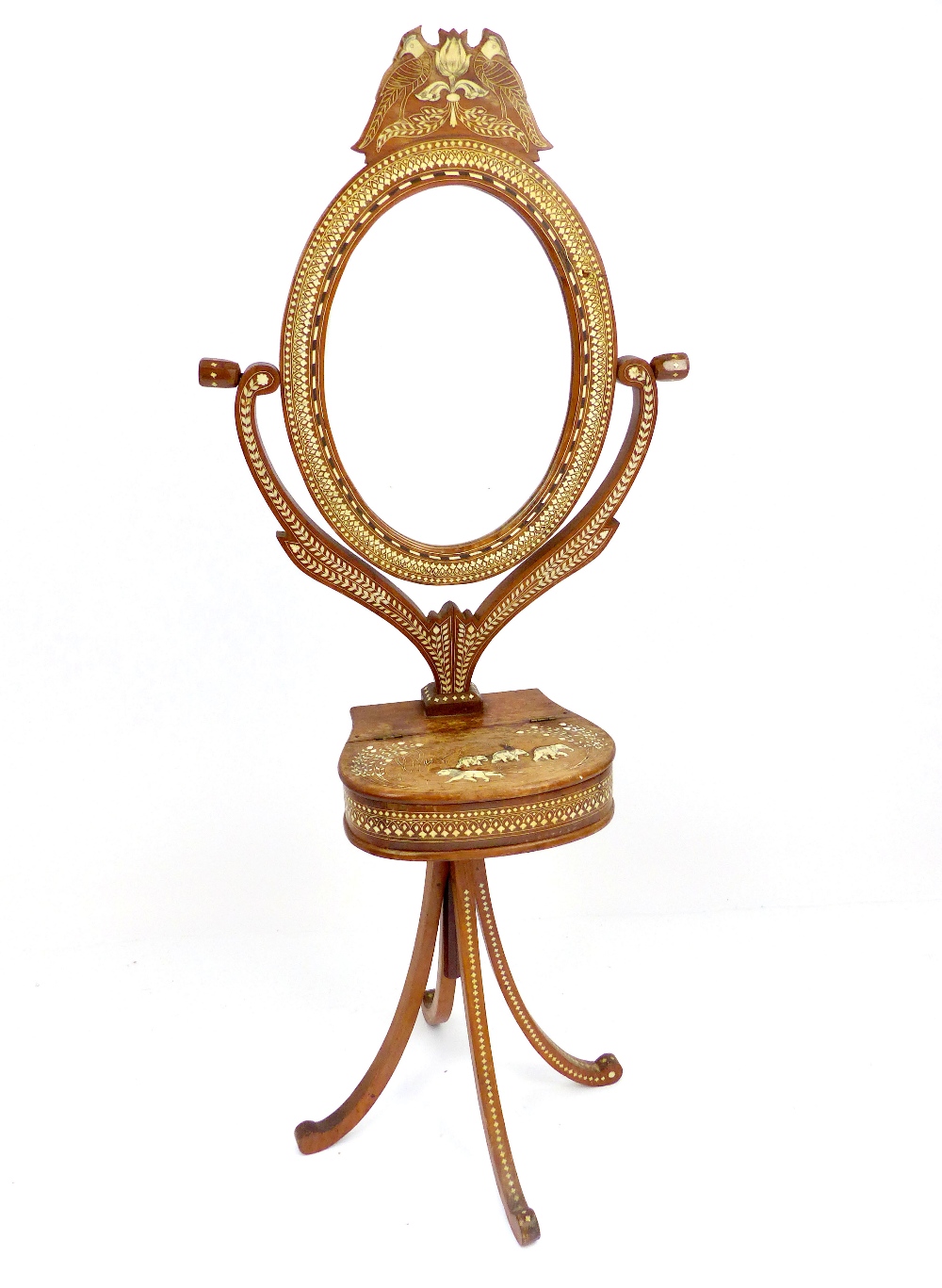 A late 19th century Anglo - Indian hardwood oval floor standing mirror, ivory inlaid geometric,