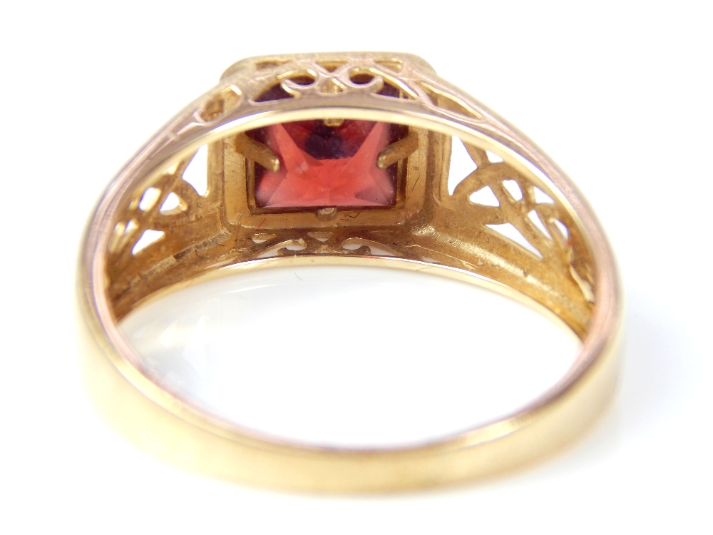 A gentleman's 9ct yellow gold garnet ring, set with square cut garnet with pierced Celtic design - Image 2 of 3