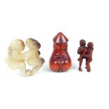 Three erotic items; a phallus netsuke, 6cm h, a hardstone carving of a cavorting couple, 5.2cm h & a