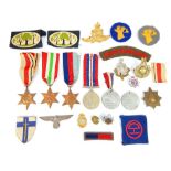 WW2 medals; Africa, Italy & 1939-45 Stars, assorted cloth & cap badges inc Canadian & German Nazi