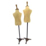 Two small fabric manequins on tripod cast iron bas