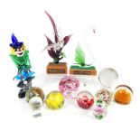 A collection of various glass paperweights, a Mura