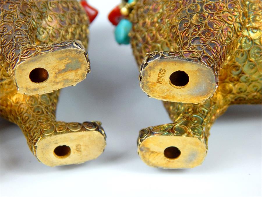 A 19th / early 20th century pair of silver gilt and enamelled Sino - Tibetan models of temple lions, - Image 5 of 5