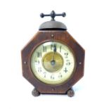 Stained oak alarm clock, of octagonal form, cream