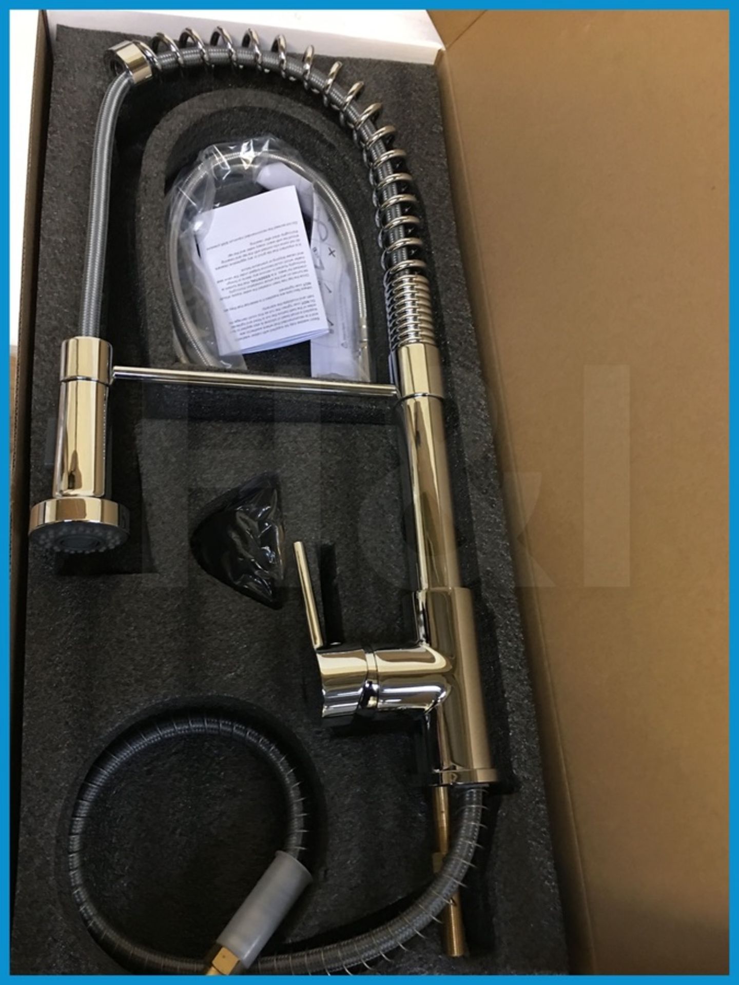 Stunning designer sprung neck kitchen mixer tap with pull down spray head in polished chrome finish.