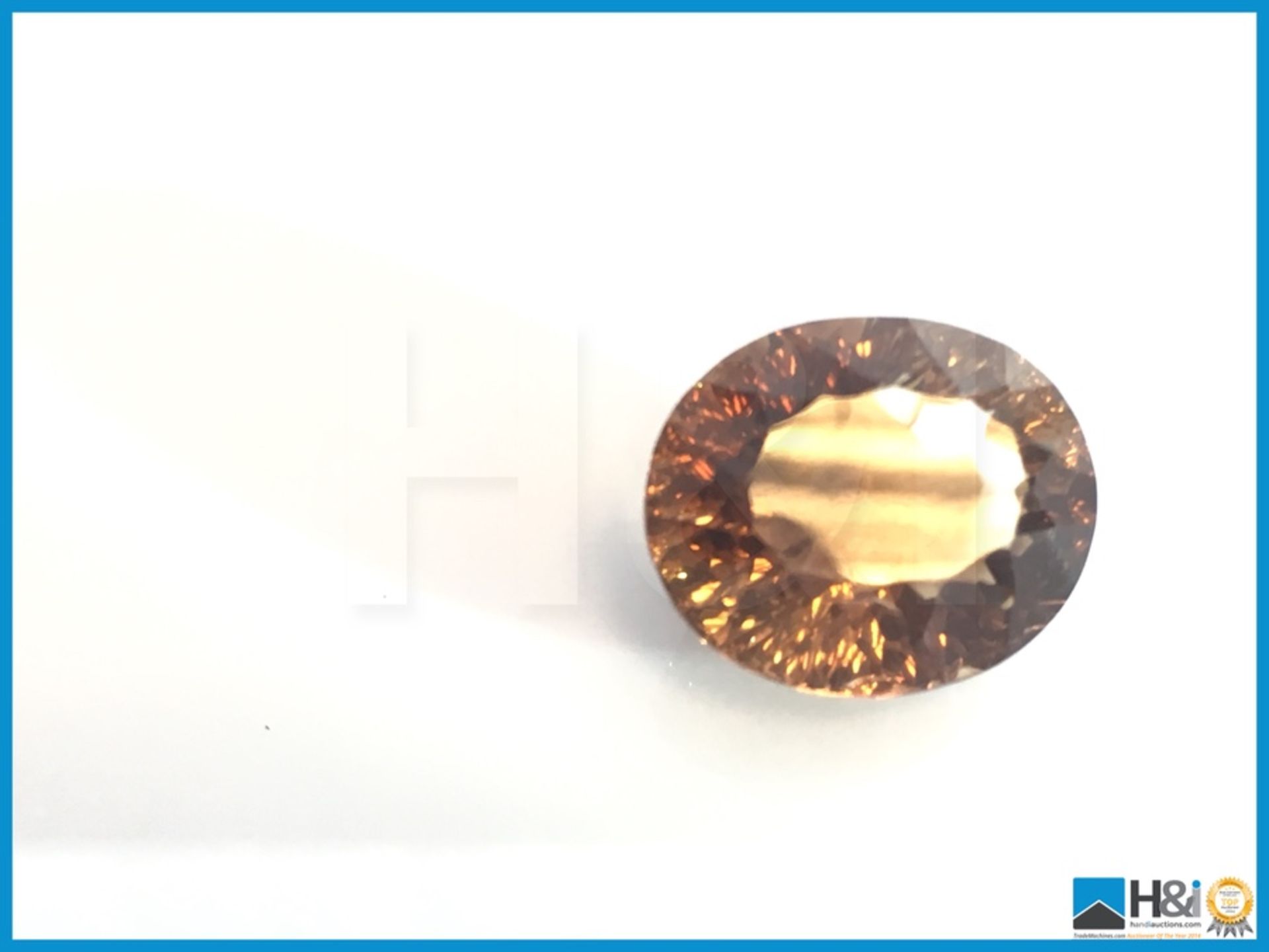 13.56ct Natural Topaz.Oval Facetted Cut in Yellowish Brown. Transparrent with GIL Certificate 14.