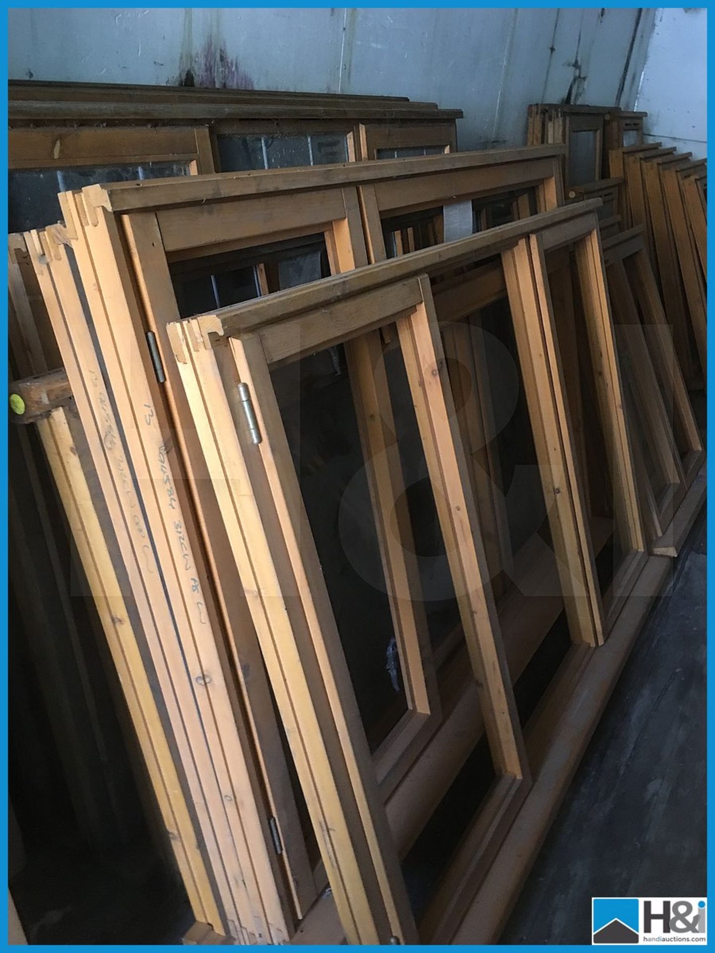 Huge quantity of unused wooden, glazed and unglazed window frames. Dusty appearance due to storage - Image 3 of 10