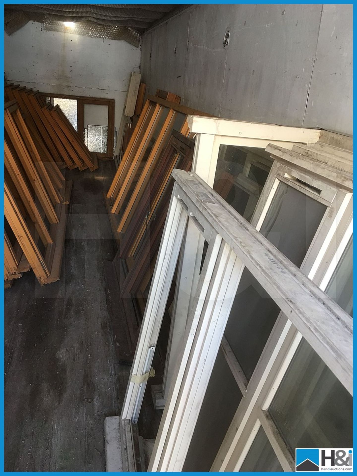 Huge quantity of unused wooden, glazed and unglazed window frames. Dusty appearance due to storage - Image 2 of 10