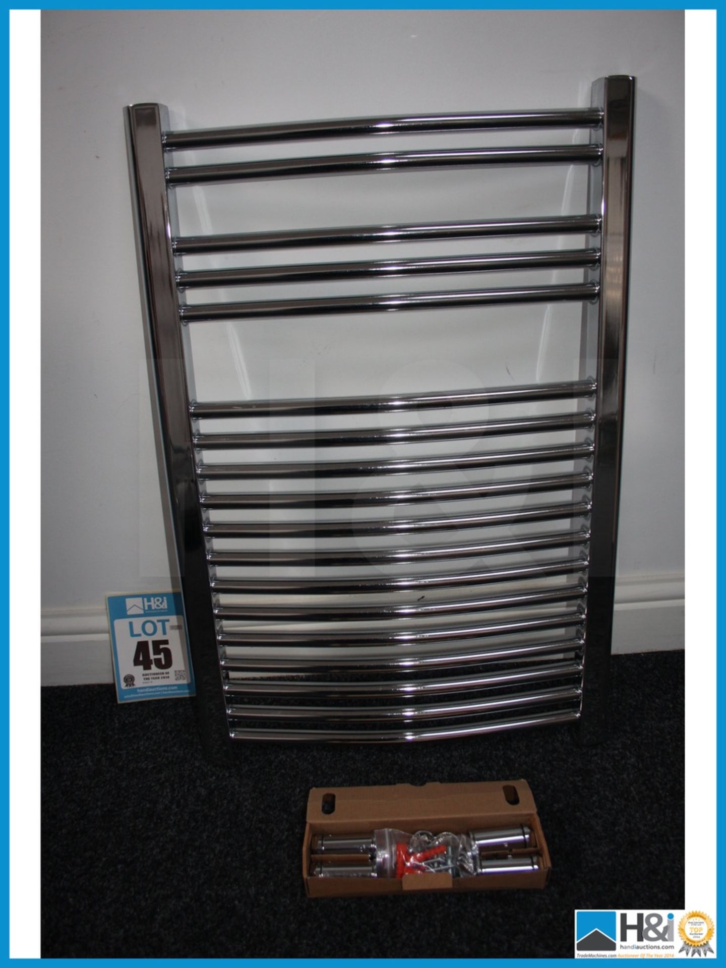Chrome curved heated towel rail with fitting kit unused and boxed 760 x 500 mm. Appraisal: Viewing