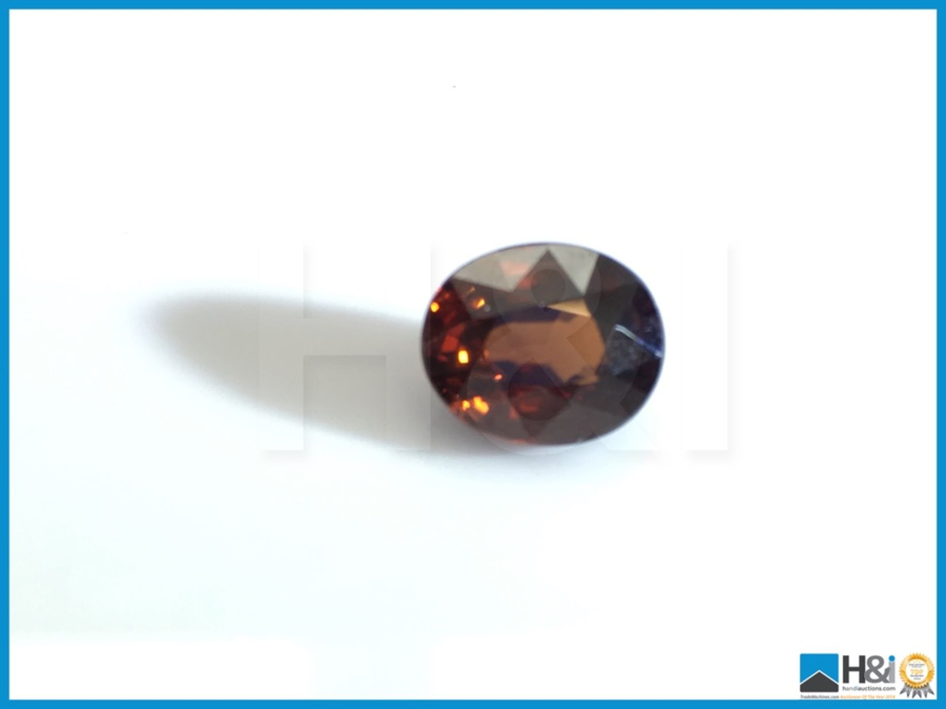 3.94ct Natural Zircon, Oval Mixed Cut in Moderate Brownish Orange, Transparent with IGI Certificate.