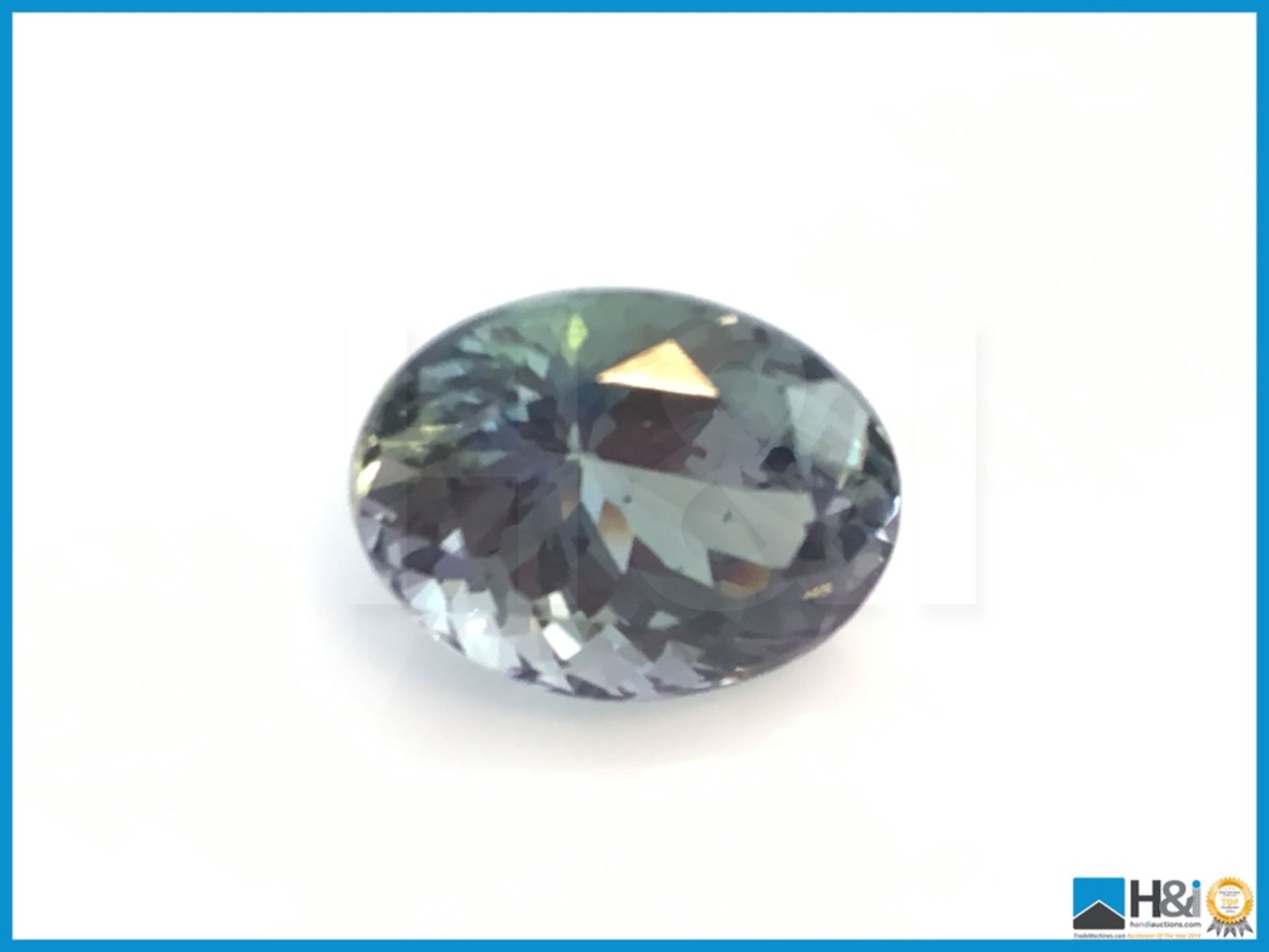 7.57ct Zoisit,Oval Fancy Cut in Violetis Green. Transparent with IGI Certificate 12.99x9.80x8.