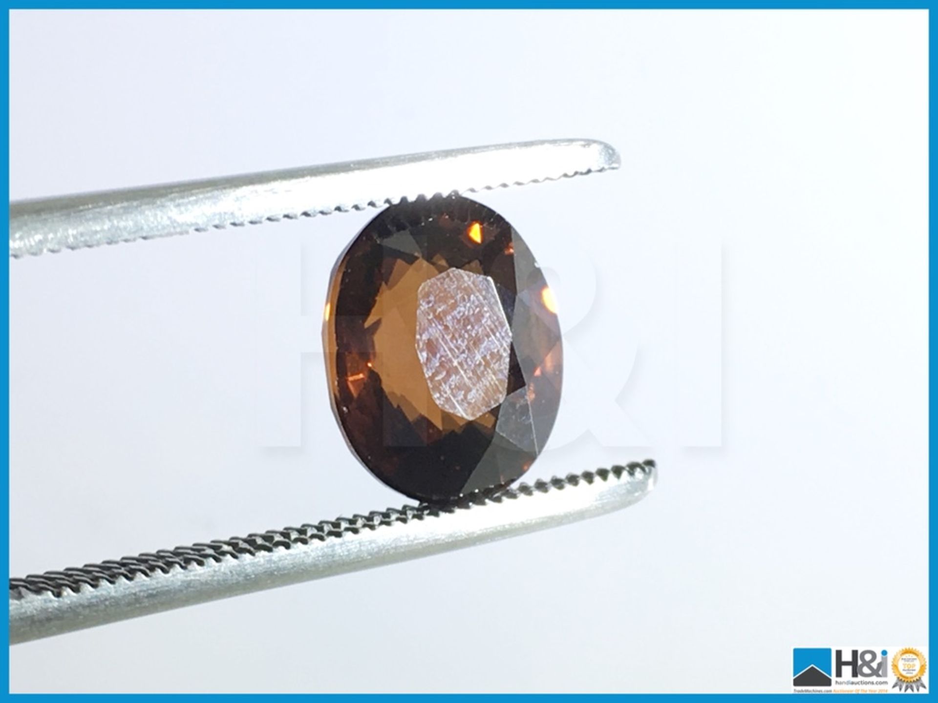 3.94ct Natural Zircon, Oval Mixed Cut in Moderate Brownish Orange, Transparent with IGI Certificate. - Image 3 of 5