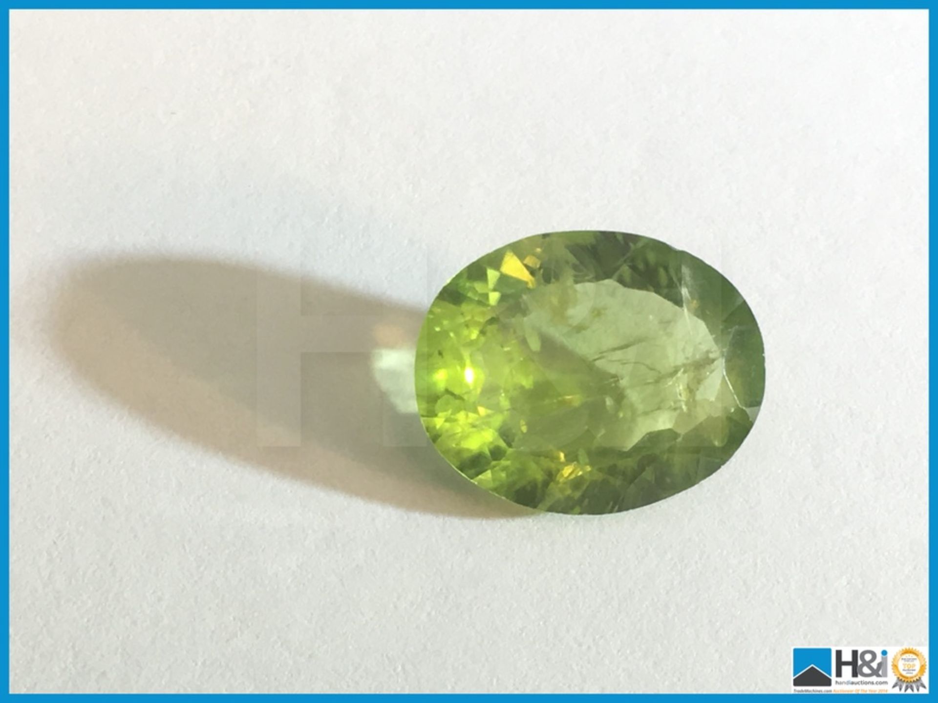 4.11ct Natural Peridot. Oval cut in Green. Size: 12.37x9.98x4.59mm. Certification: None Appraisal: - Image 2 of 4