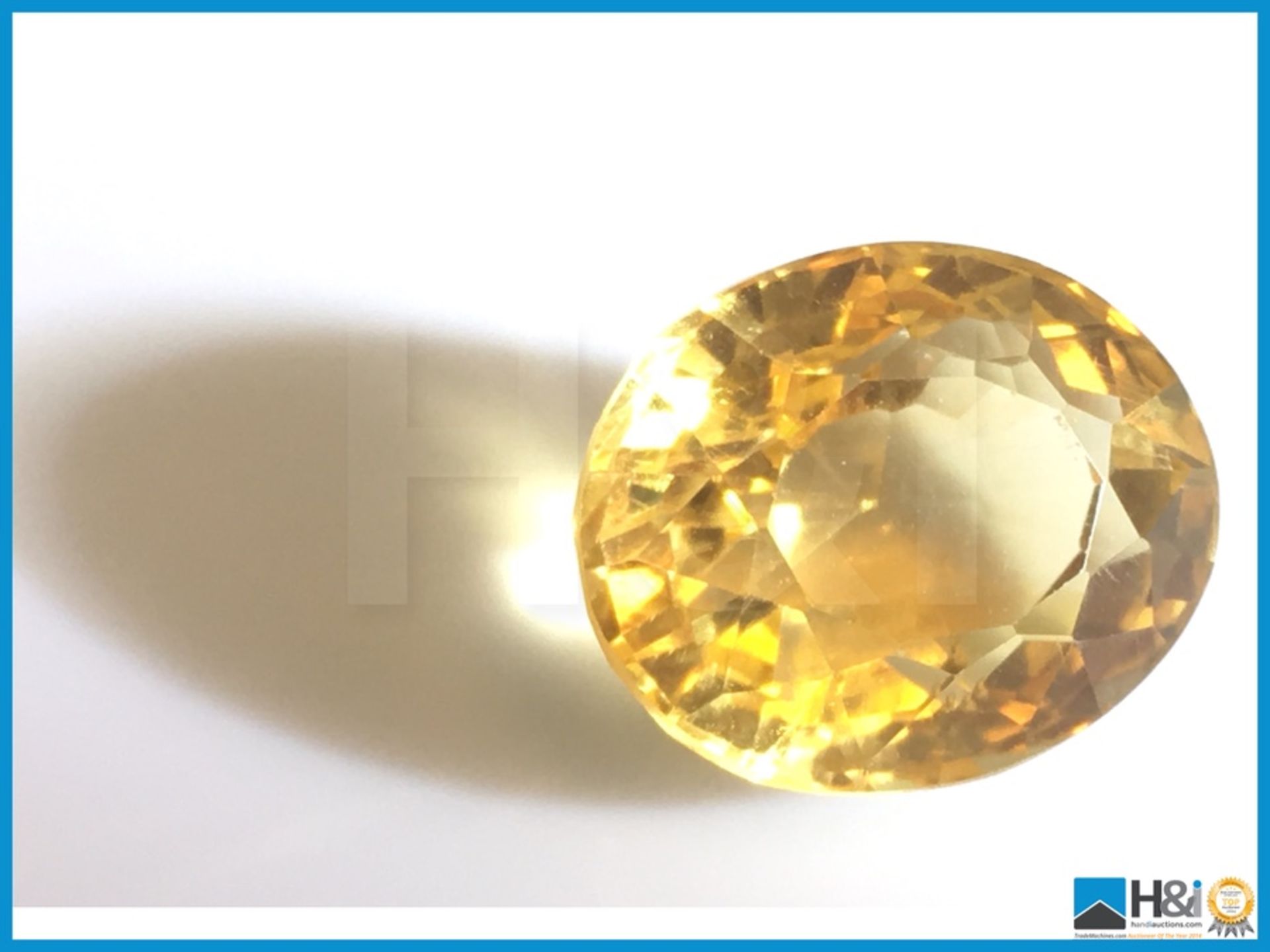9.80ct Natural Citrine in Yellow. Oval Cut, Transparent 13.90x11.44x10.50mm. Certification: None