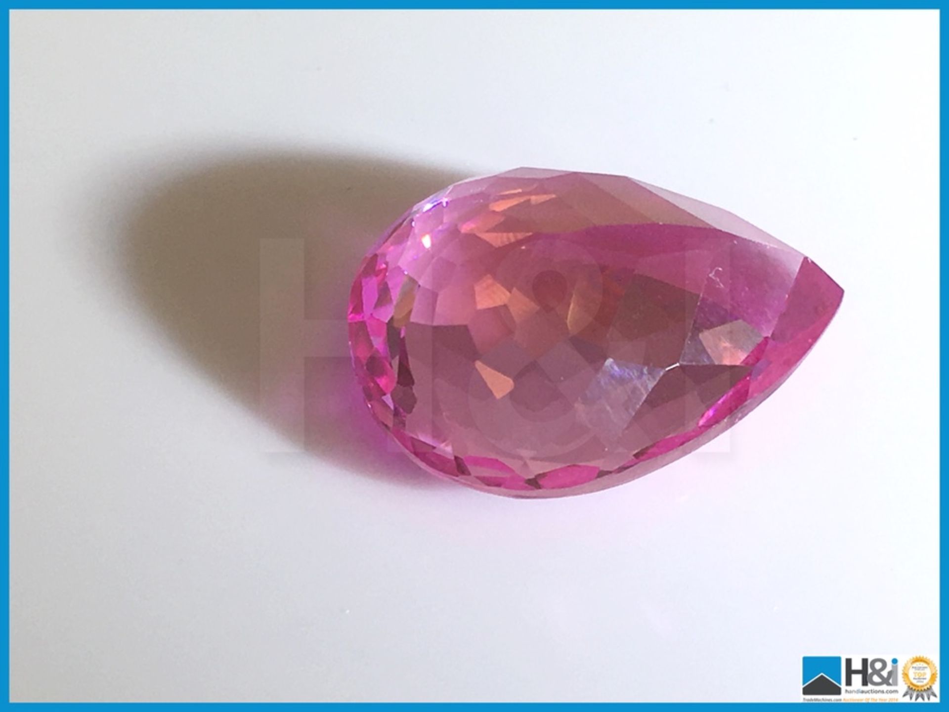 16.58ct Natural Topaz. Pear cut in Strong Pink. Transparent. Size: 23.41x19.18x13.19mm. - Image 2 of 3