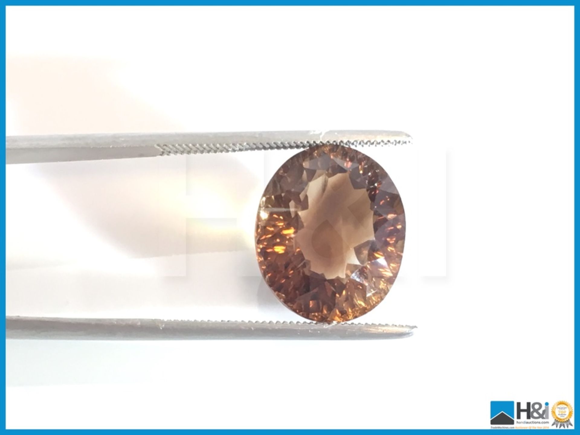 13.56ct Natural Topaz.Oval Facetted Cut in Yellowish Brown. Transparrent with GIL Certificate 14. - Bild 3 aus 4