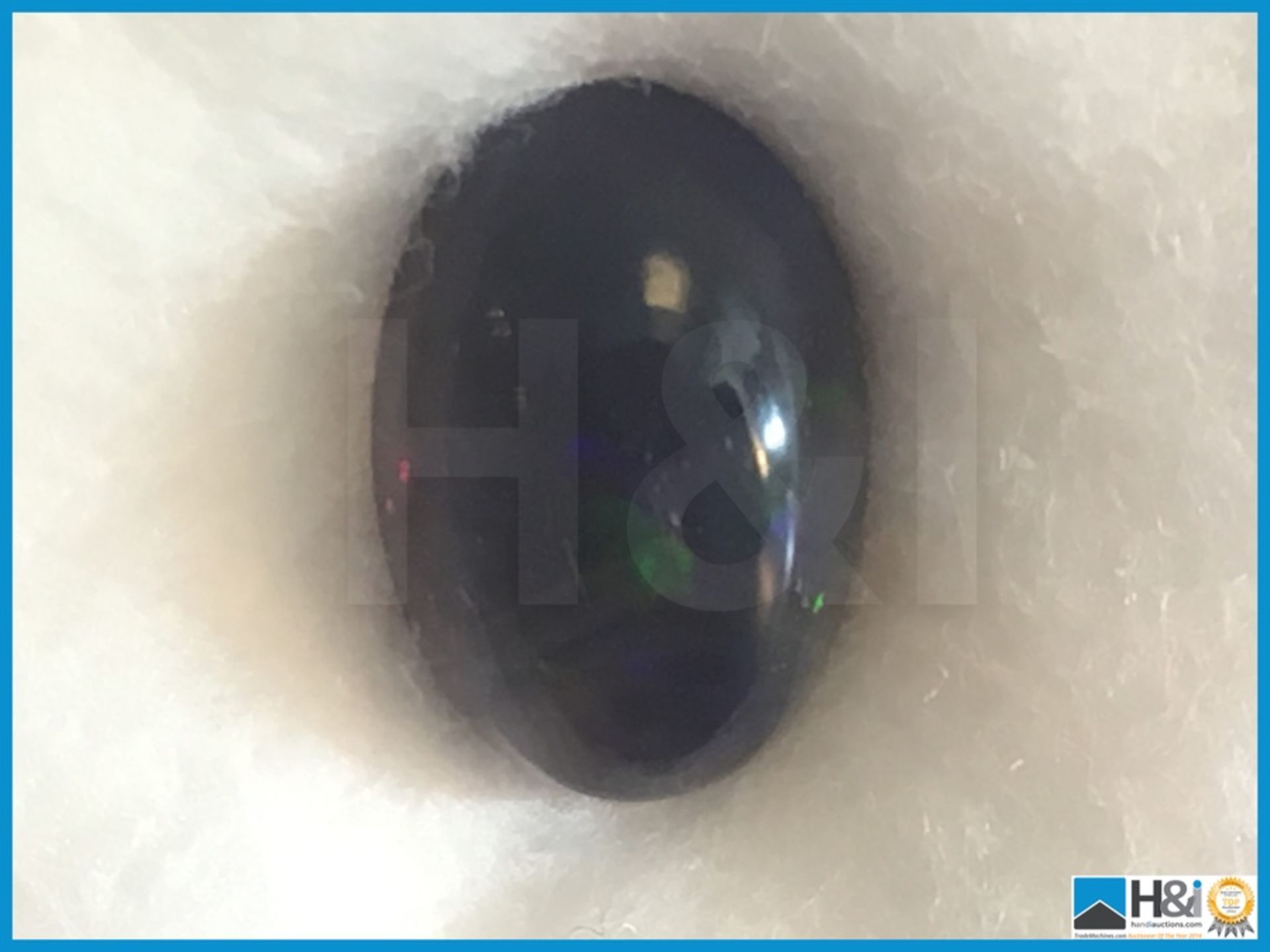 3.70ct Natural Opal. Oval Cabochon in Black with play of colours. Size: 13.17x9.10x6.71mm.