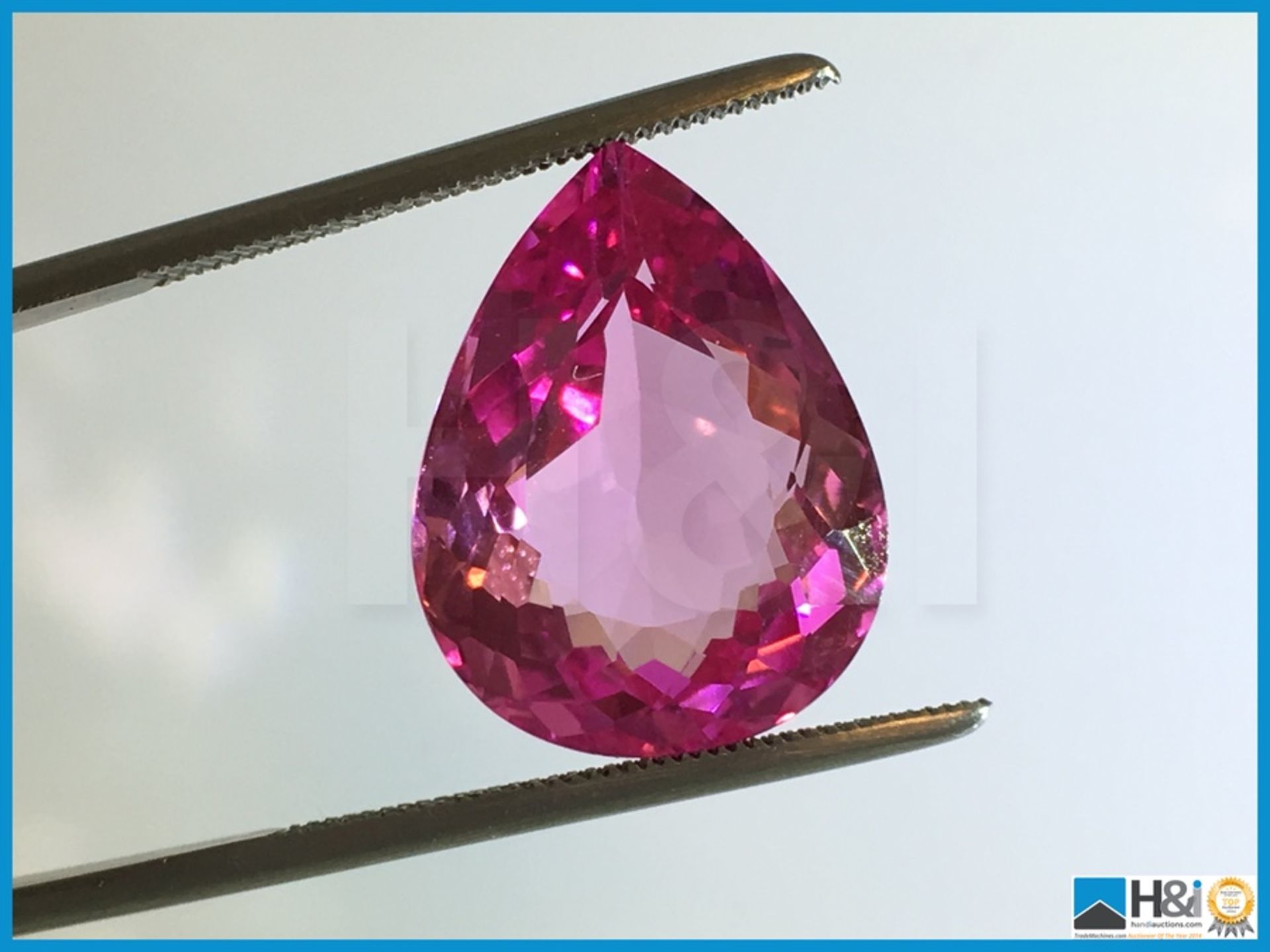 16.58ct Natural Topaz. Pear cut in Strong Pink. Transparent. Size: 23.41x19.18x13.19mm. - Image 3 of 3