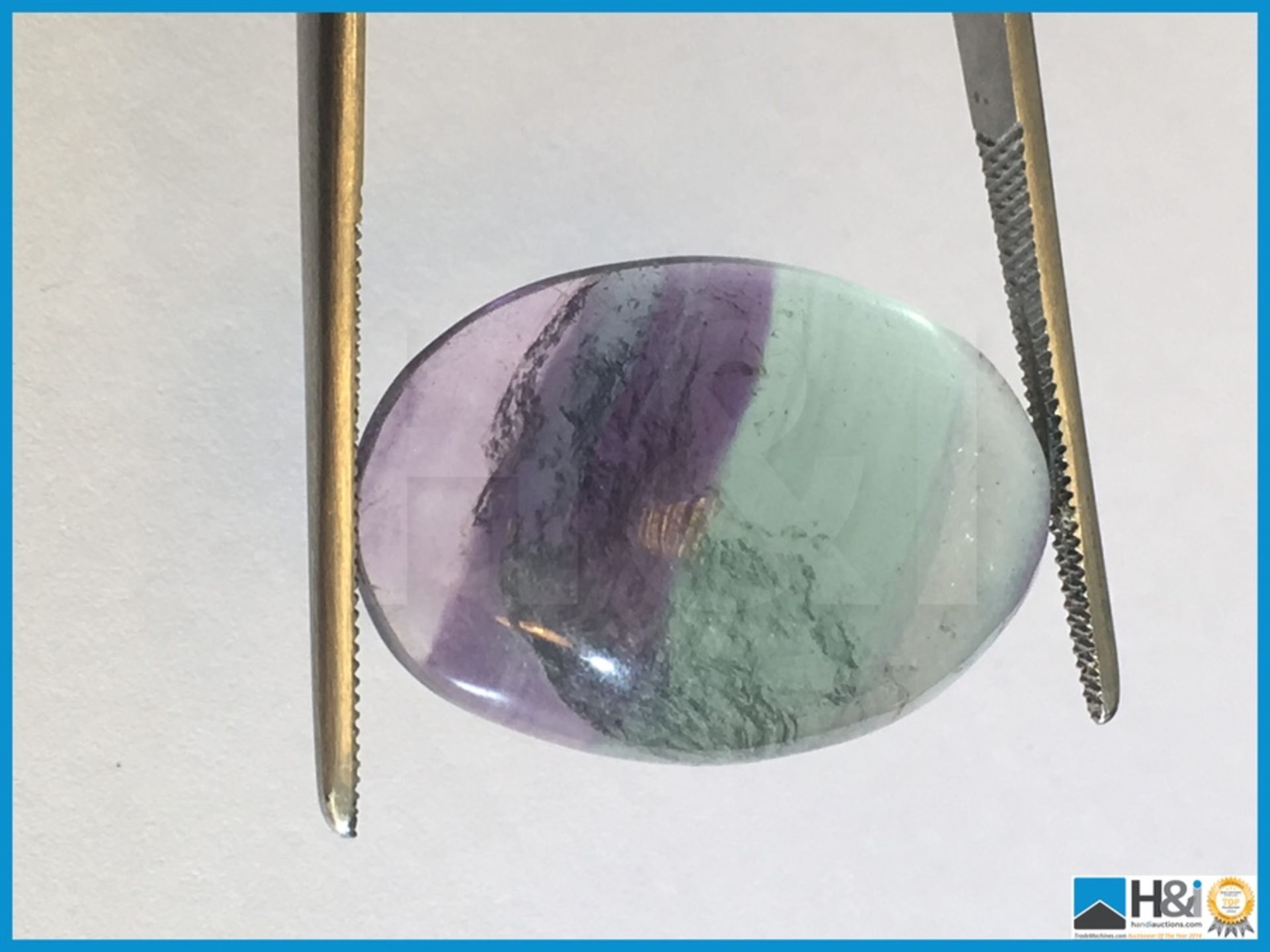 31.40ct Earth Mined Fluorite Brazilian Gemstone. Oval cut in Greenish purple colour, Very pretty.