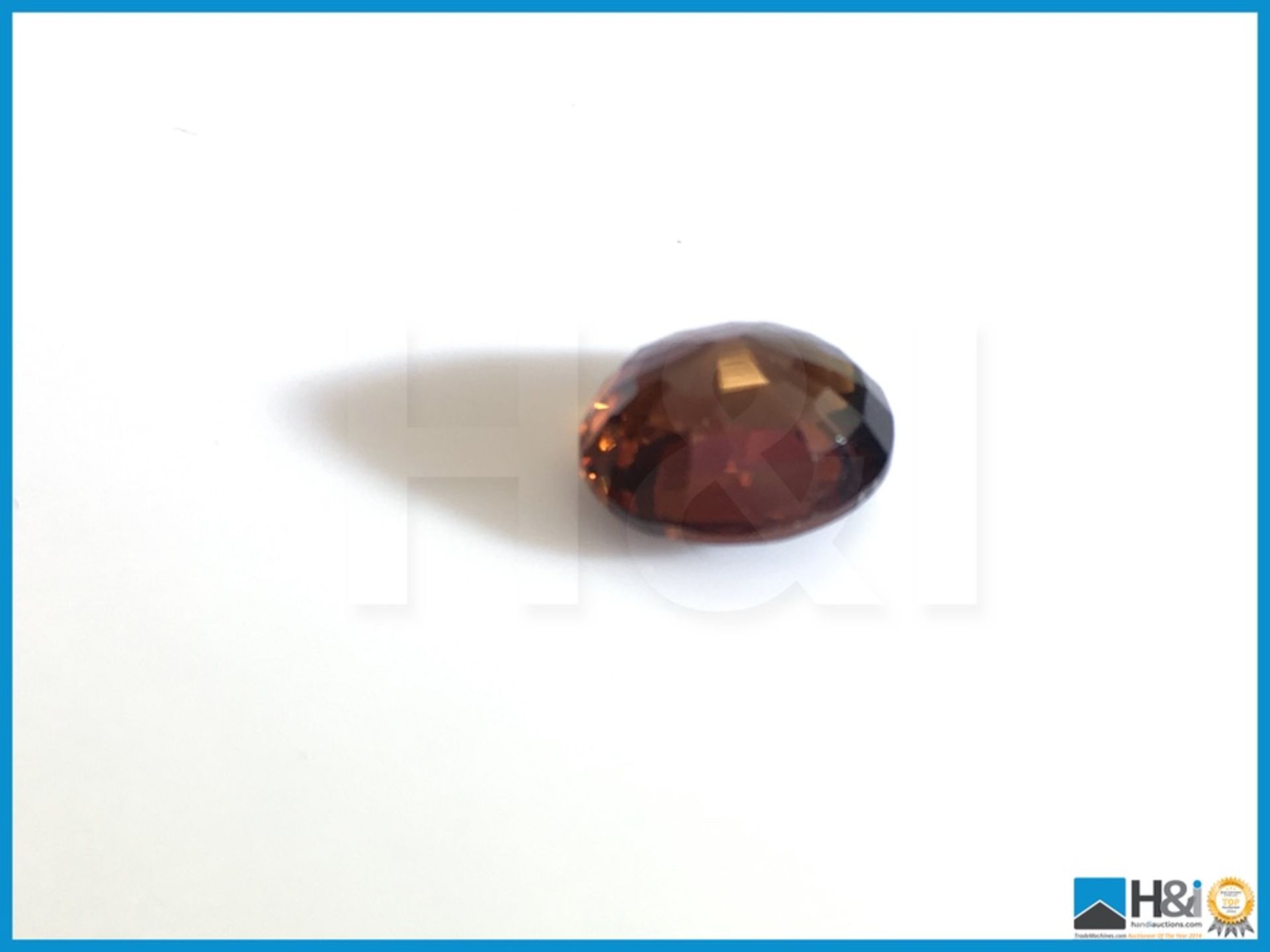 3.94ct Natural Zircon, Oval Mixed Cut in Moderate Brownish Orange, Transparent with IGI Certificate. - Image 2 of 5