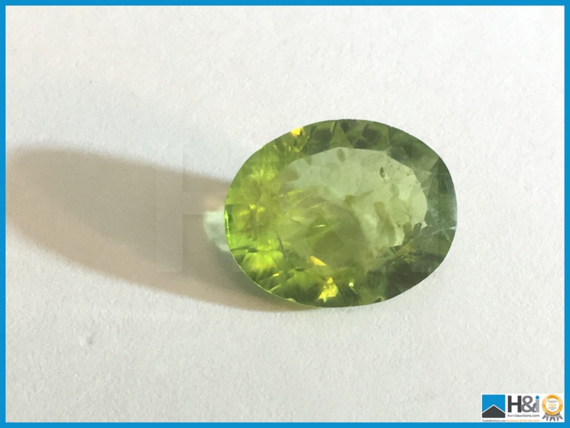 4.11ct Natural Peridot. Oval cut in Green. Size: 12.37x9.98x4.59mm. Certification: None Appraisal: